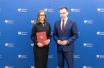 Małgorzata Krok, nowy szef Krajowej Administracji Skarbowej obok ministra finansów Andrzeja Domańskiego